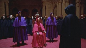 Tom Cruise, in the black cloak on the right, gets the third degree from Kubrick's Illuminati.